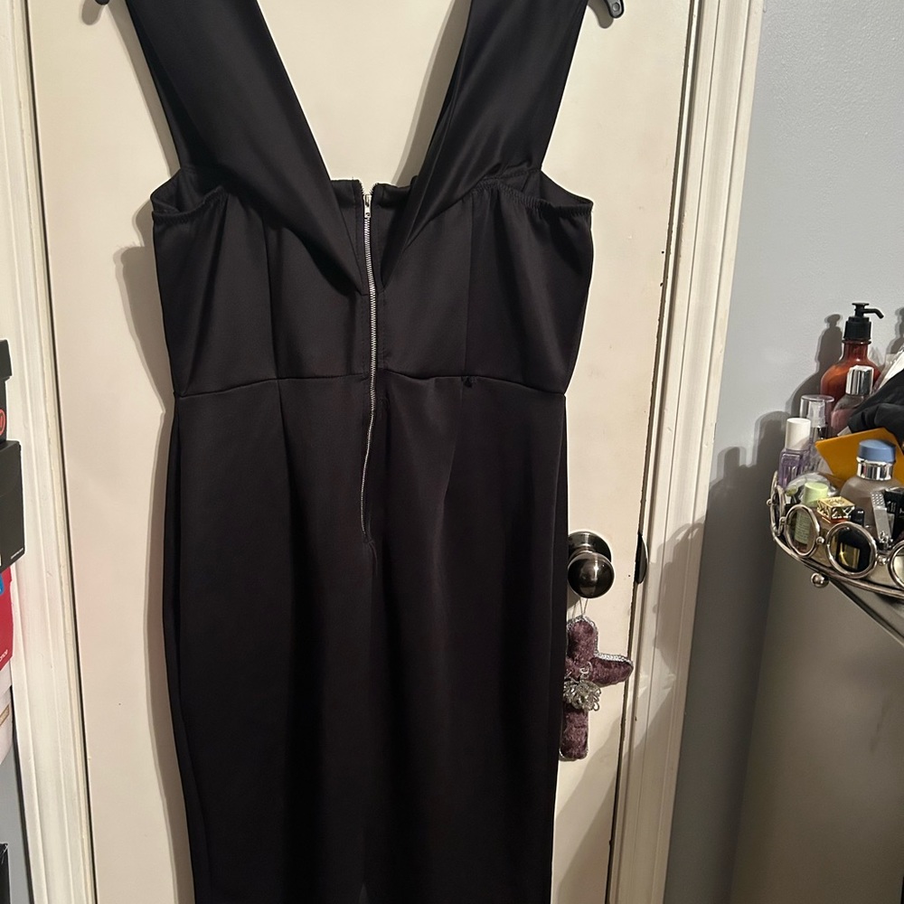 Cute black party dress with plenty of stretch zip down back. Midi length
